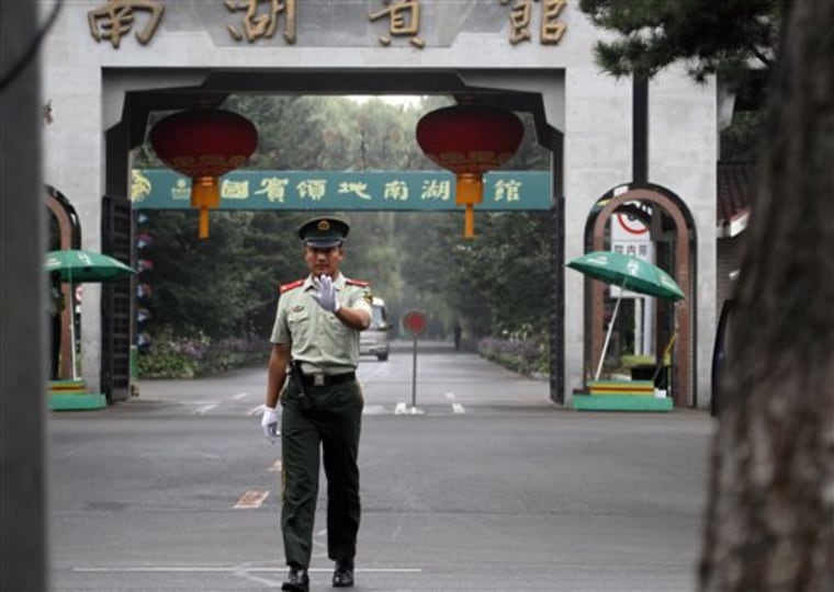 A Chinese paramilitary police man gestures for a photographer to stop shooting pictures outside the Nan Hu hotel where North Korean leader Kim Jong Il is believed to be staying after he arrived at Changchun in northeastern China's Jilin province on Friday. 